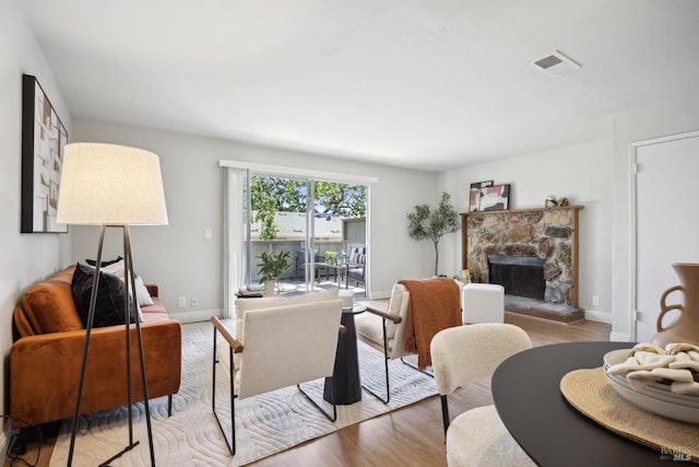 1259 Royal Oak Ter Unit A, Novato, CA 94947 - living area featuring wood finished floors, a fireplace, and baseboards