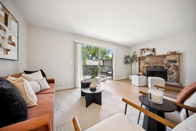 1259 Royal Oak Ter Unit A, Novato, CA 94947 - living room with a fireplace, wood finished floors, and baseboards