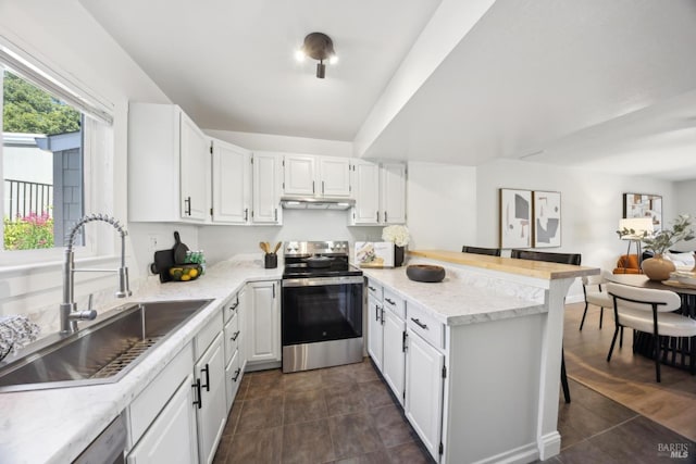 1259 Royal Oak Ter Unit A, Novato, CA 94947 - kitchen with stainless steel appliances, a sink, a peninsula, under cabinet range hood, and white cabinets