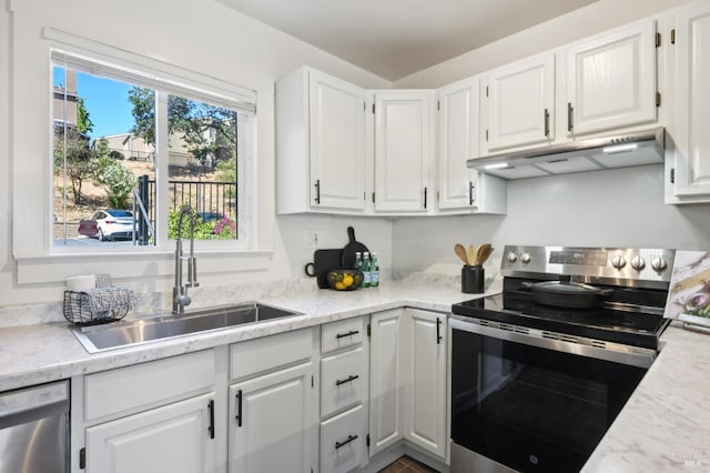 1259 Royal Oak Ter Unit A, Novato, CA 94947 - kitchen featuring appliances with stainless steel finishes, under cabinet range hood, a sink, and white cabinetry