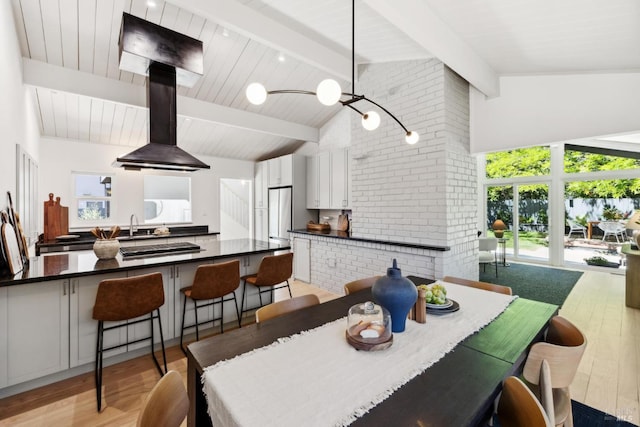 2647 Heatherstone Dr, San Rafael, CA 94903 - dining area with light wood-type flooring, beam ceiling, and high vaulted ceiling
