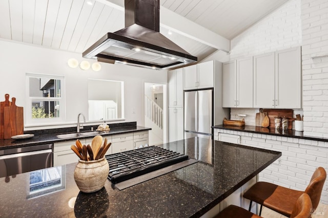 2647 Heatherstone Dr, San Rafael, CA 94903 - kitchen with stainless steel appliances, wall chimney exhaust hood, a sink, dark stone counters, and white cabinetry