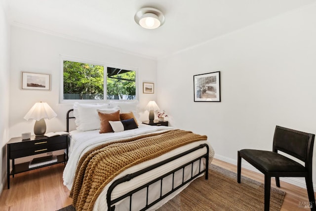 2647 Heatherstone Dr, San Rafael, CA 94903 - bedroom featuring ornamental molding, wood finished floors, and baseboards