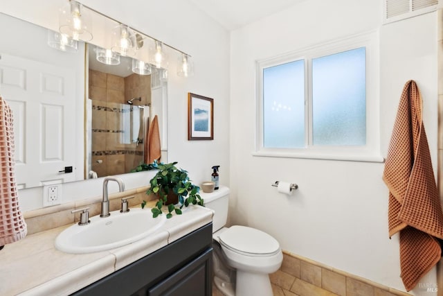 2647 Heatherstone Dr, San Rafael, CA 94903 - full bath featuring vanity, toilet, a tile shower, baseboards, and tile patterned floors