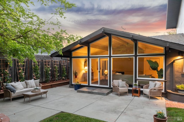 2647 Heatherstone Dr, San Rafael, CA 94903 - back of property at dusk with an outdoor living space and a patio area
