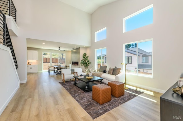 1970 Bent Tree Pl, Santa Rosa, CA 95404 - living room with a towering ceiling, light wood-style floors, a ceiling fan, and baseboards