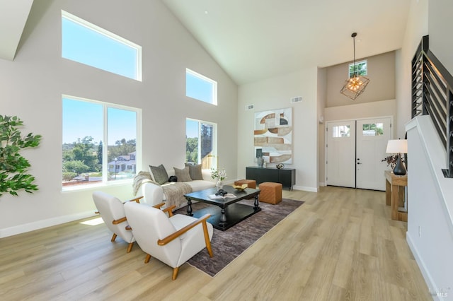 1970 Bent Tree Pl, Santa Rosa, CA 95404 - living area with a high ceiling, a chandelier, light wood-style flooring, and baseboards
