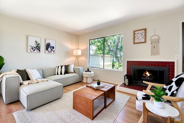 52 Margarita Ter, Novato, CA 94947 - living area with light wood-type flooring, a tiled fireplace, and baseboards