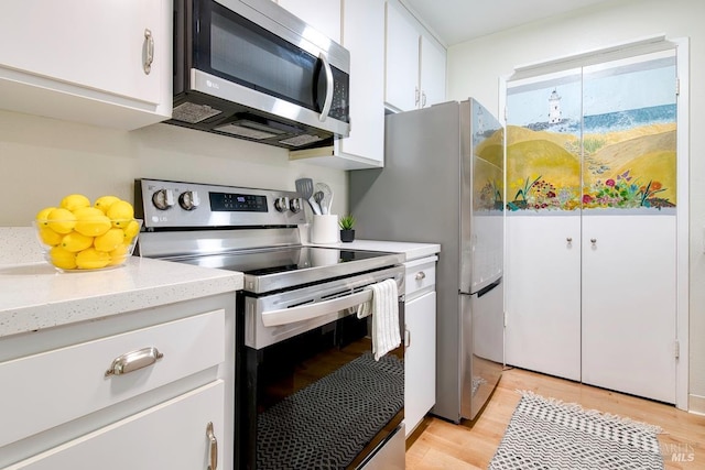 52 Margarita Ter, Novato, CA 94947 - kitchen featuring appliances with stainless steel finishes, white cabinets, and light wood-style floors