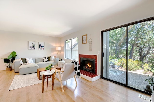 52 Margarita Ter, Novato, CA 94947 - living room with light wood-style flooring and a brick fireplace