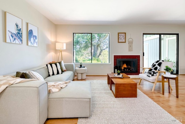 52 Margarita Ter, Novato, CA 94947 - living area featuring plenty of natural light, light wood-style floors, and a brick fireplace