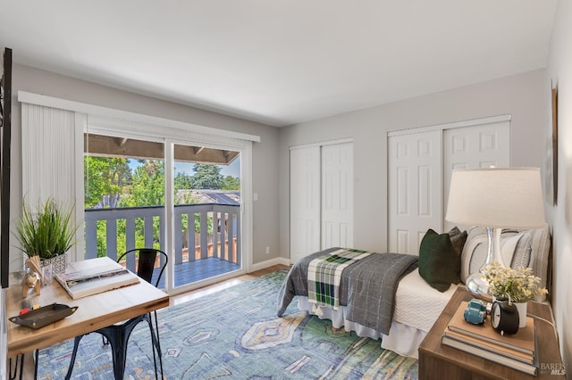 118 Summerwood Pl, Concord, CA 94518 - bedroom featuring access to outside, two closets, baseboards, wood finished floors, and an office area