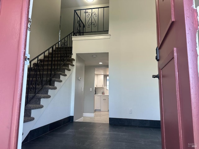 69 Eastside Cir, Petaluma, CA 94954 - entryway with stairway, baseboards, wood finished floors, and a towering ceiling