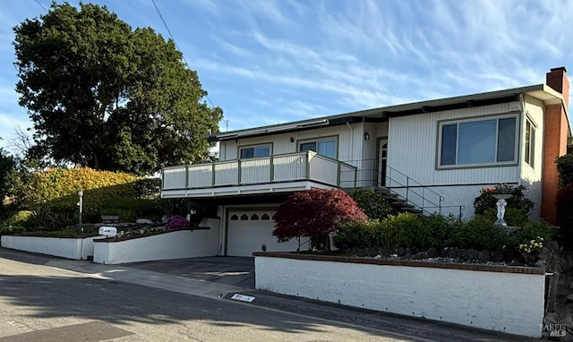 view of front of property with an attached garage and driveway
