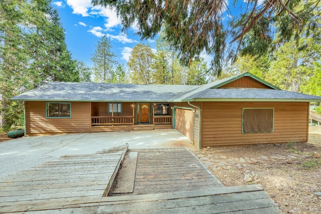 19828 Greenview Dr, Twain Harte, CA 95383 - view of front of home with driveway, an attached garage, and a deck
