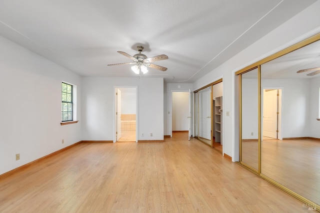 19828 Greenview Dr, Twain Harte, CA 95383 - unfurnished bedroom featuring two closets, light wood-style flooring, and baseboards