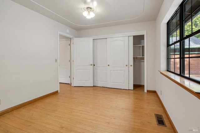 19828 Greenview Dr, Twain Harte, CA 95383 - unfurnished bedroom with baseboards, light wood-style floors, and a closet