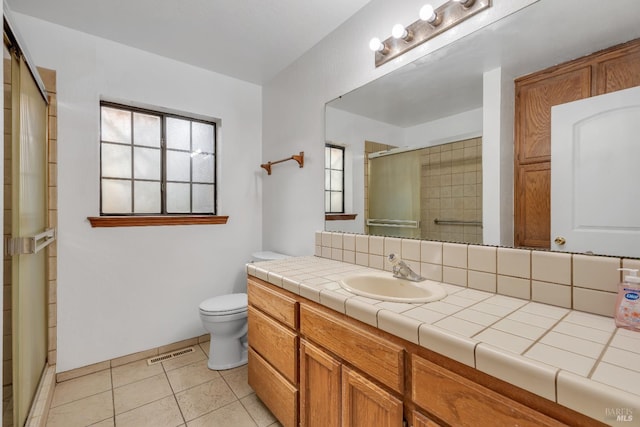 19828 Greenview Dr, Twain Harte, CA 95383 - bathroom with a shower stall, toilet, vanity, and tile patterned flooring