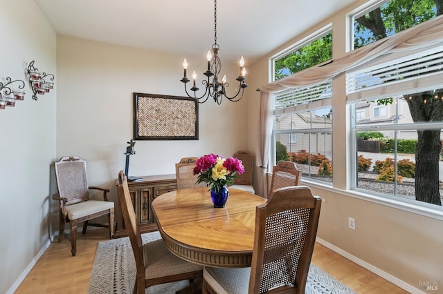 809 Muscat Ct, Petaluma, CA 94954 - dining area with light wood-style flooring, a chandelier, and baseboards