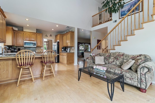 809 Muscat Ct, Petaluma, CA 94954 - living room featuring healthy amount of natural light, light wood-type flooring, stairway, and recessed lighting
