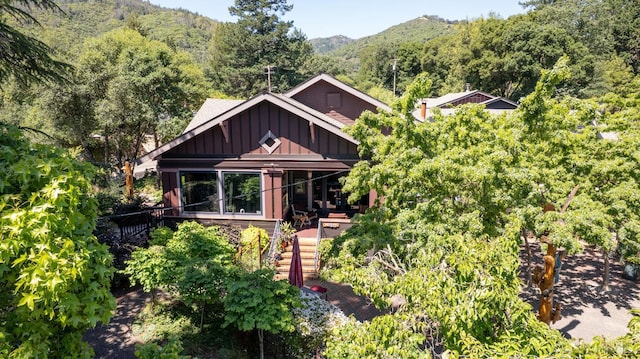420 Todd Rd, Ukiah, CA 95482 - view of front of property featuring board and batten siding, stairway, a wooded view, and a mountain view