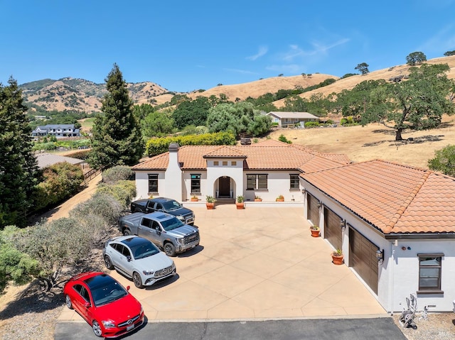 1745 Durbin Ln, Fairfield, CA 94534 - view of front of home with stucco siding, a tiled roof, and a mountain view