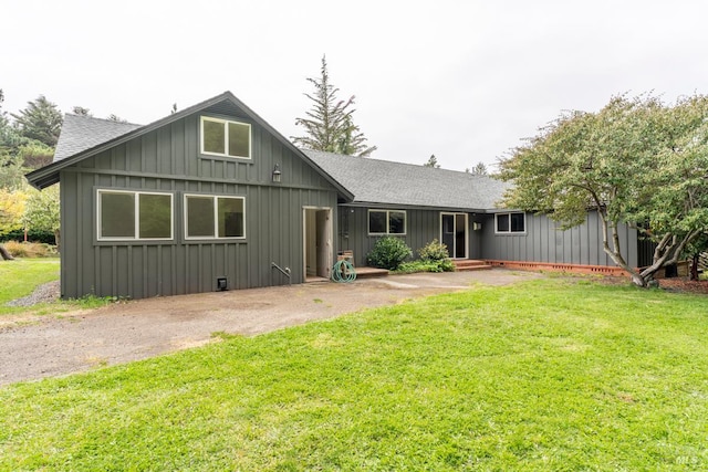 43390 Comptche Ukiah Rd, Mendocino, CA 95460 - view of front facade featuring board and batten siding, a shingled roof, and a front lawn