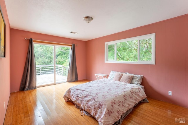 43390 Comptche Ukiah Rd, Mendocino, CA 95460 - bedroom with access to exterior and light wood-style floors
