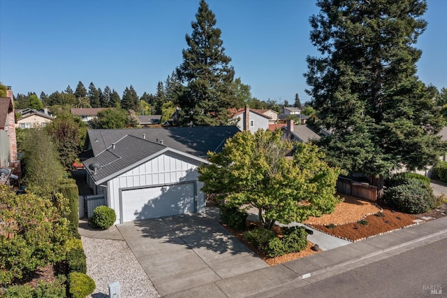 2010 Caulfield Ln, Petaluma, CA 94954 - view of front of property with board and batten siding, an attached garage, concrete driveway, and a residential view