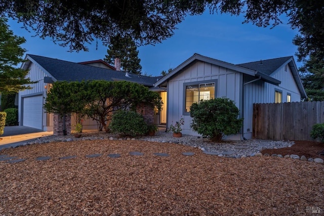 2010 Caulfield Ln, Petaluma, CA 94954 - view of front of home featuring board and batten siding, a garage, and roof with shingles