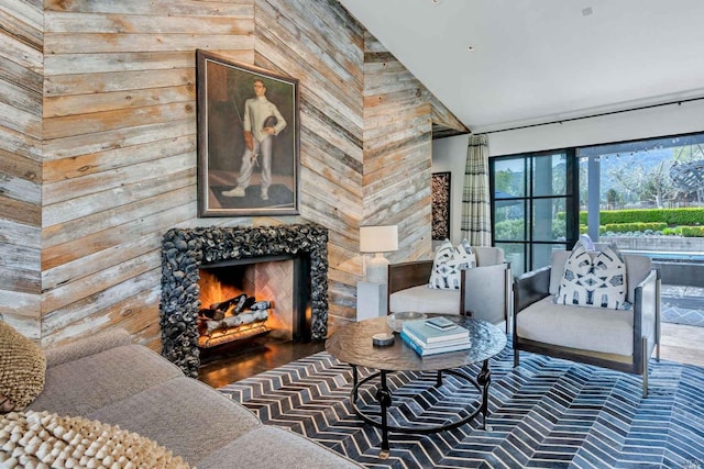 1005 Valley View St, Saint Helena, CA 94574 - living area with wooden walls, a warm lit fireplace, high vaulted ceiling, and wood finished floors