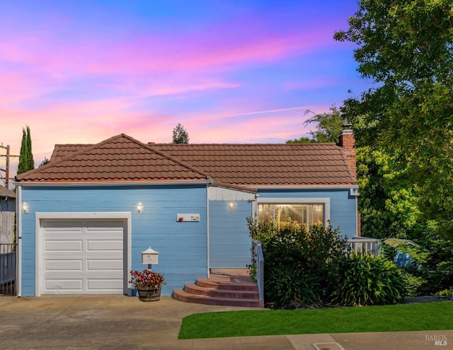 740 Valle Vista Ave, Vallejo, CA 94590 - view of front of house featuring a tile roof, a garage, a chimney, and concrete driveway