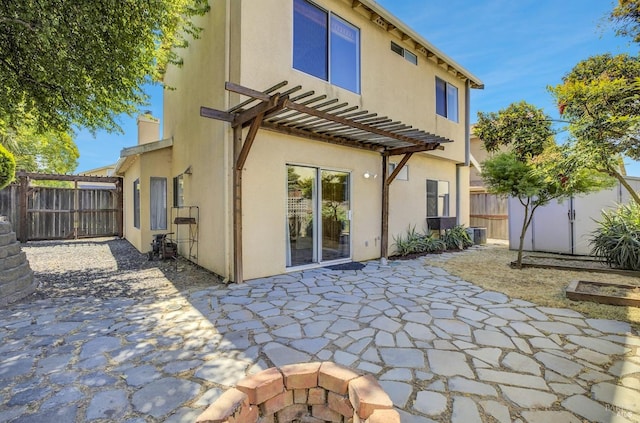 115 Barington Dr, Vallejo, CA 94591 - rear view of property with stucco siding, a patio area, a fenced backyard, and a chimney