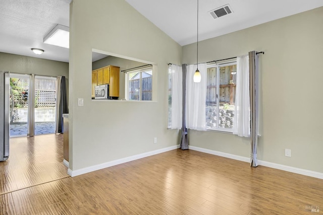 115 Barington Dr, Vallejo, CA 94591 - unfurnished dining area featuring light wood-style floors, baseboards, and lofted ceiling