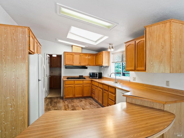 31300 Pine Mountain Rd, Cloverdale, CA 95425 - kitchen with white appliances, a sink, light wood-style flooring, under cabinet range hood, and lofted ceiling