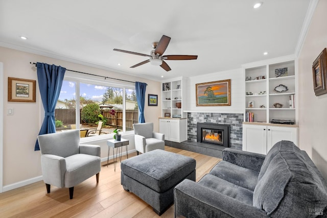 3524 Cascade St, Napa, CA 94558 - living area featuring light wood-type flooring, ornamental molding, baseboards, ceiling fan, and a tile fireplace