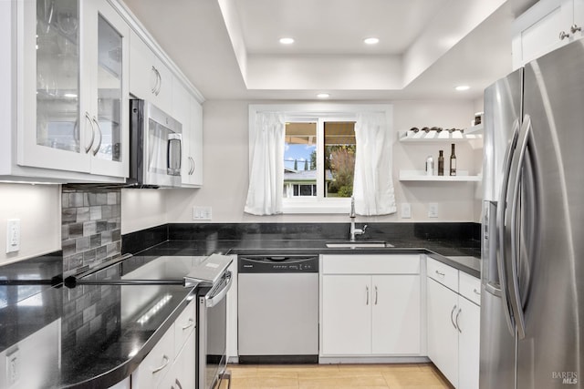 3524 Cascade St, Napa, CA 94558 - kitchen featuring stainless steel appliances, a sink, white cabinets, glass insert cabinets, and open shelves