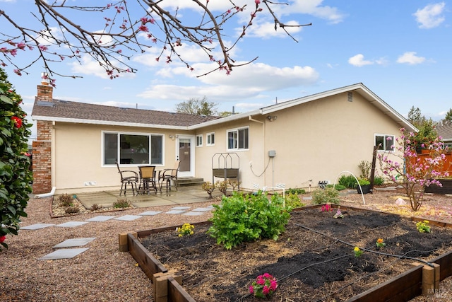 3524 Cascade St, Napa, CA 94558 - rear view of house with a vegetable garden, stucco siding, a patio, a chimney, and a shingled roof