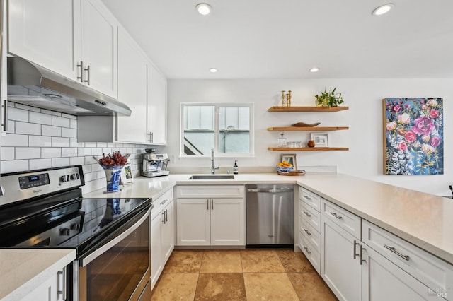 110 Morning Sun Ave, Mill Valley, CA 94941 - kitchen featuring appliances with stainless steel finishes, a sink, under cabinet range hood, decorative backsplash, and white cabinetry
