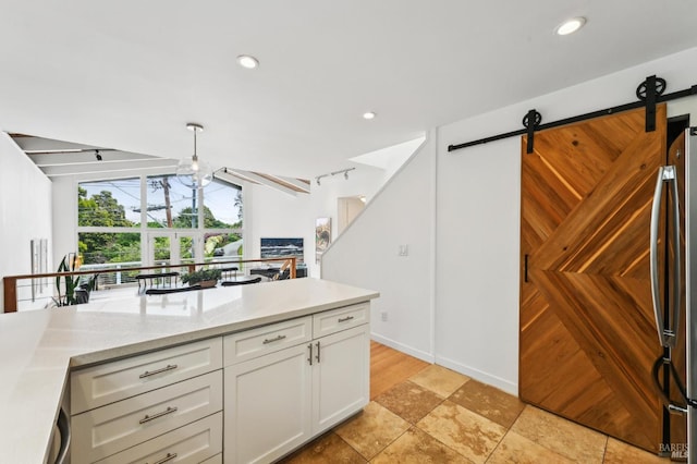 110 Morning Sun Ave, Mill Valley, CA 94941 - kitchen featuring white cabinetry, freestanding refrigerator, recessed lighting, a barn door, and light stone counters