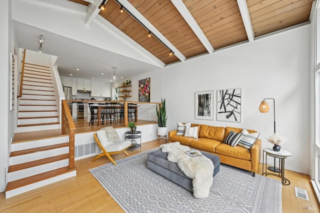110 Morning Sun Ave, Mill Valley, CA 94941 - living room featuring track lighting, light wood-style flooring, wooden ceiling with exposed beams, stairs, and high vaulted ceiling