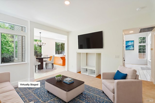 2752 Hillview Dr, Fairfield, CA 94534 - living room with a chandelier, recessed lighting, and baseboards