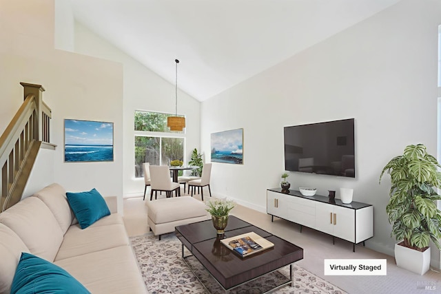 2752 Hillview Dr, Fairfield, CA 94534 - living room with high vaulted ceiling, stairs, and baseboards