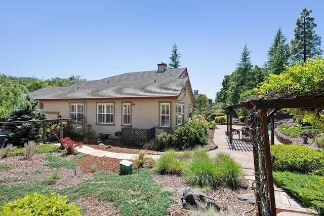 90 Oak Shade Ln, Novato, CA 94945 - rear view of house featuring a pergola, a patio area, and a chimney