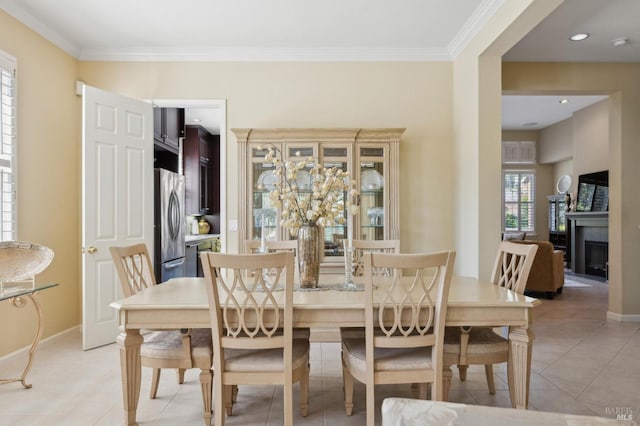 90 Oak Shade Ln, Novato, CA 94945 - dining area featuring baseboards, ornamental molding, a fireplace, and light tile patterned floors