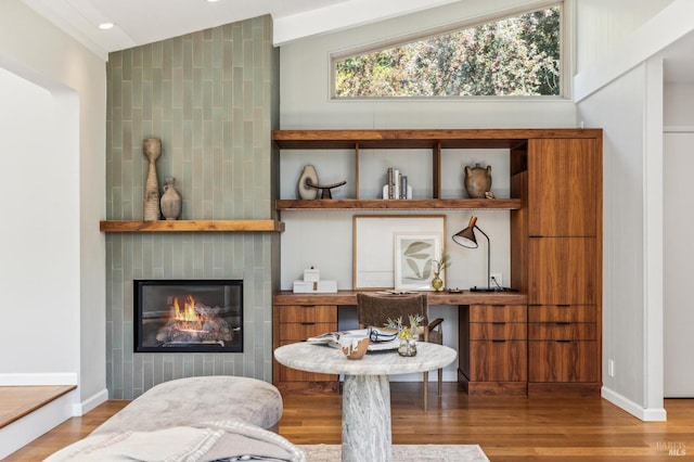 442 Laverne Ave, Mill Valley, CA 94941 - living room with wood finished floors, a tiled fireplace, lofted ceiling, baseboards, and recessed lighting
