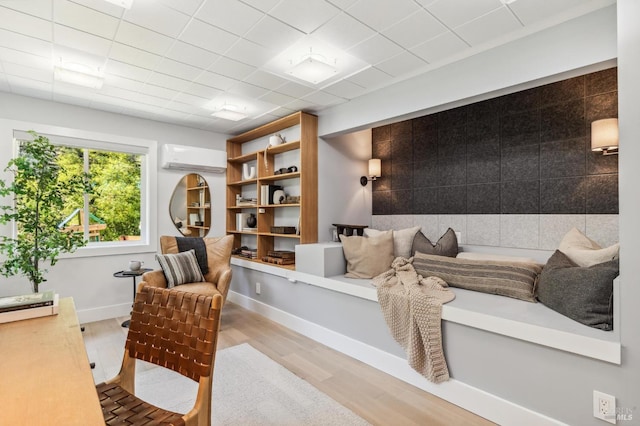 442 Laverne Ave, Mill Valley, CA 94941 - sitting room with a wall unit AC, wood finished floors, and baseboards