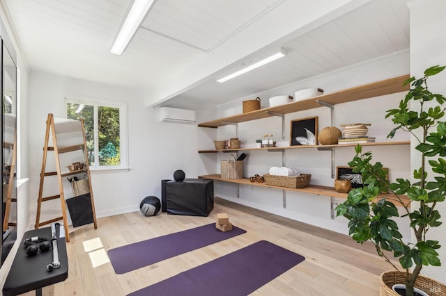 442 Laverne Ave, Mill Valley, CA 94941 - exercise room featuring a wall mounted AC, wood finished floors, and baseboards
