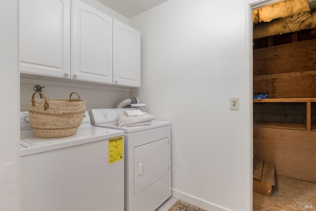 90 George Ln, Sausalito, CA 94965 - washroom featuring cabinet space, washing machine and clothes dryer, baseboards, and light wood-style floors