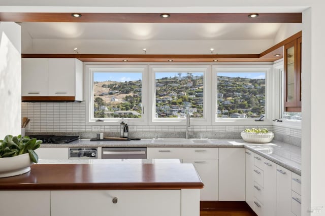 84 Eastview Ave, Tiburon, CA 94920 - kitchen with stainless steel dishwasher, backsplash, white cabinetry, recessed lighting, and gas stovetop